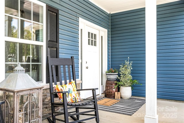 property entrance with covered porch
