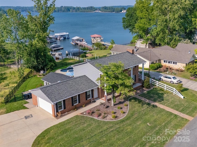 birds eye view of property with a water view