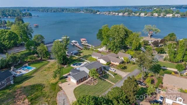 birds eye view of property with a water view and a residential view