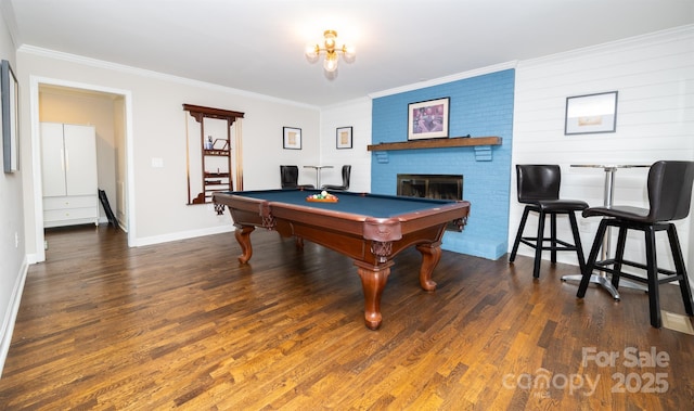 rec room with ornamental molding, billiards, and wood finished floors