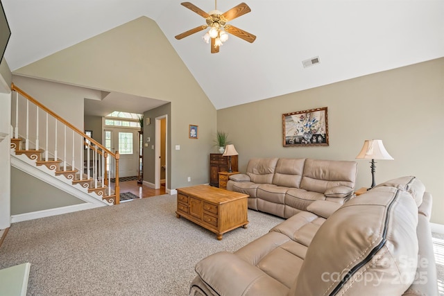 14340 Kendalton Meadow Dr, Mint Hill, NC 28227 - living room with high vaulted ceiling, ceiling fan, stairway, light carpet, and baseboards