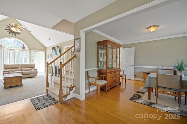 14340 Kendalton Meadow Dr, Mint Hill, NC 28227 - foyer with stairs, wood finished floors, ceiling fan, vaulted ceiling, and ornamental molding