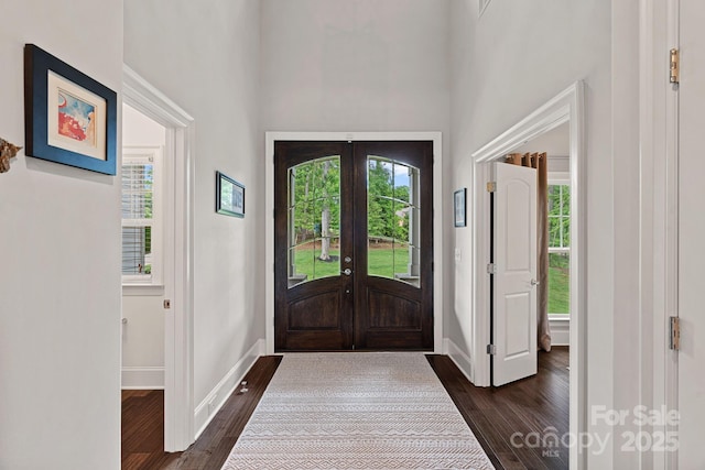 112 Nautilus Ct, Troutman, NC 28166 - foyer featuring dark wood finished floors, french doors, a high ceiling, and baseboards