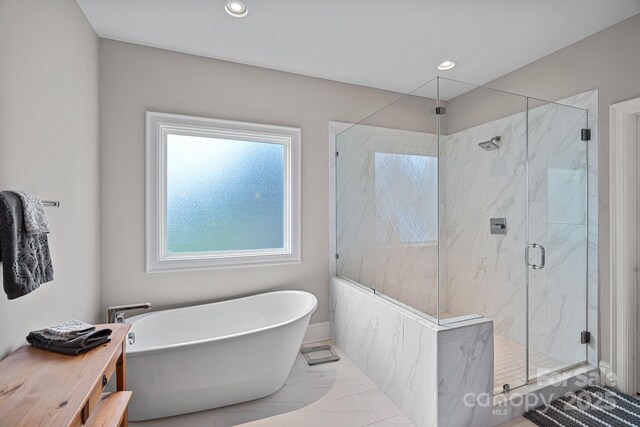 112 Nautilus Ct, Troutman, NC 28166 - full bathroom with a soaking tub, marble finish floors, a marble finish shower, and recessed lighting