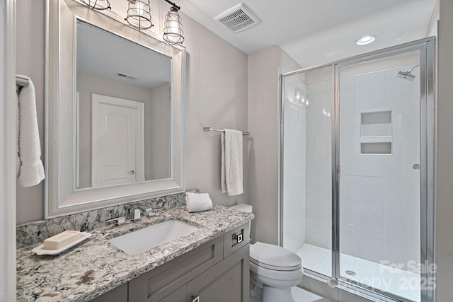 112 Nautilus Ct, Troutman, NC 28166 - full bathroom featuring toilet, a shower stall, vanity, and recessed lighting