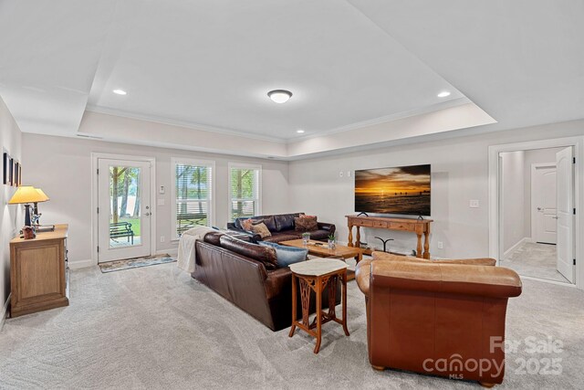 112 Nautilus Ct, Troutman, NC 28166 - living room featuring a raised ceiling, light colored carpet, ornamental molding, baseboards, and recessed lighting