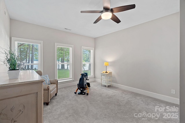 112 Nautilus Ct, Troutman, NC 28166 - living area featuring plenty of natural light, baseboards, light carpet, and ceiling fan
