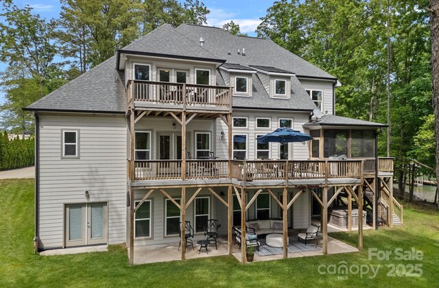 112 Nautilus Ct, Troutman, NC 28166 - rear view of property with french doors, a sunroom, a yard, and a patio area
