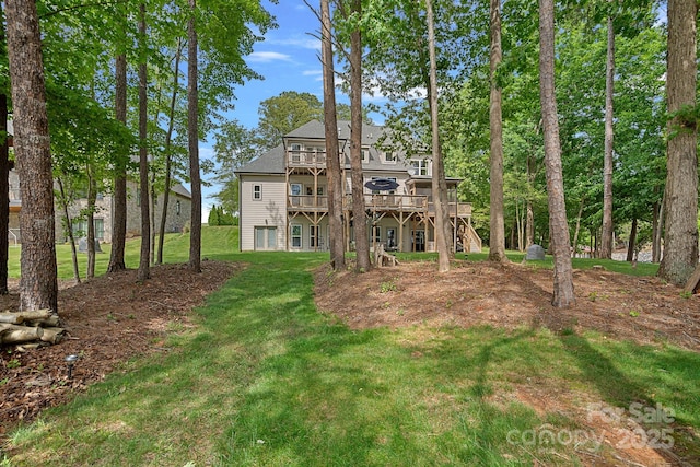 112 Nautilus Ct, Troutman, NC 28166 - back of house with a deck, a lawn, and stairway