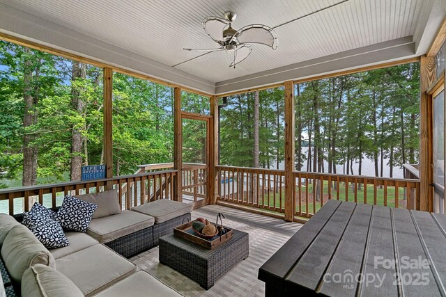 112 Nautilus Ct, Troutman, NC 28166 - sunroom featuring an outdoor living space, a ceiling fan, and view of scattered trees