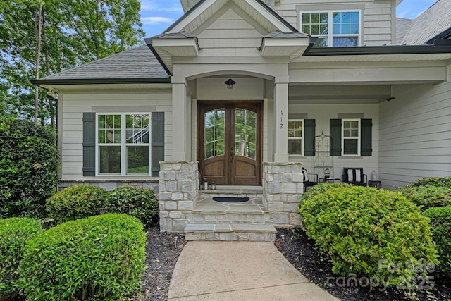 112 Nautilus Ct, Troutman, NC 28166 - doorway to property featuring roof with shingles and a porch