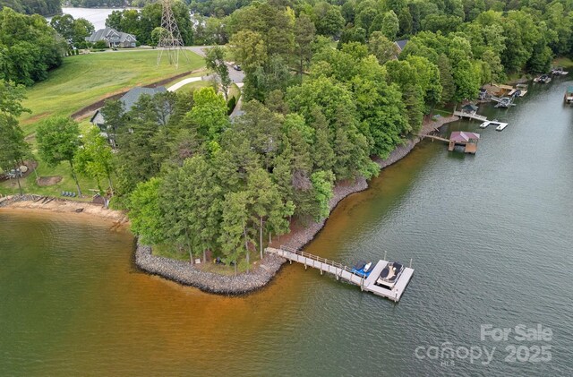 112 Nautilus Ct, Troutman, NC 28166 - aerial view of property and surrounding area with a large body of water and a tree filled landscape