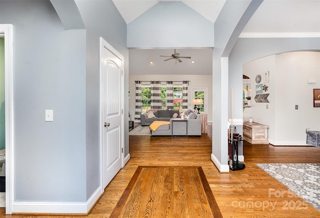 6603 Havencrest Dr, Denver, NC 28037 - hallway with wood finished floors, arched walkways, vaulted ceiling, and baseboards