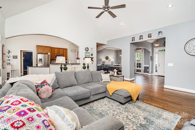 6603 Havencrest Dr, Denver, NC 28037 - living room with arched walkways, a ceiling fan, dark wood-type flooring, high vaulted ceiling, and recessed lighting