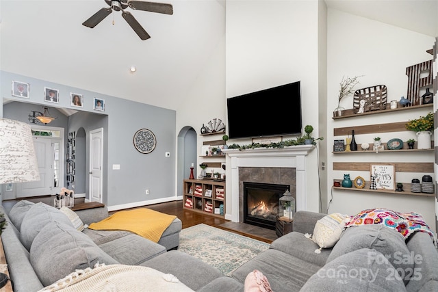 6603 Havencrest Dr, Denver, NC 28037 - living area featuring arched walkways, ceiling fan, high vaulted ceiling, wood finished floors, and a fireplace