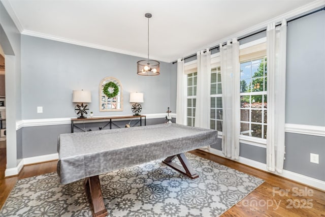 6603 Havencrest Dr, Denver, NC 28037 - recreation room featuring baseboards, wood finished floors, crown molding, and arched walkways