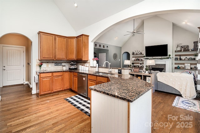 6603 Havencrest Dr, Denver, NC 28037 - kitchen with a sink, stainless steel dishwasher, a ceiling fan, high vaulted ceiling, and light wood-style floors