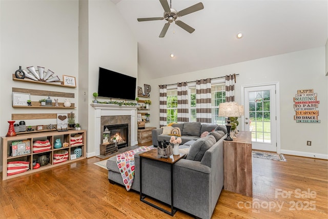 6603 Havencrest Dr, Denver, NC 28037 - living area with ceiling fan, wood finished floors, high vaulted ceiling, a tile fireplace, and recessed lighting