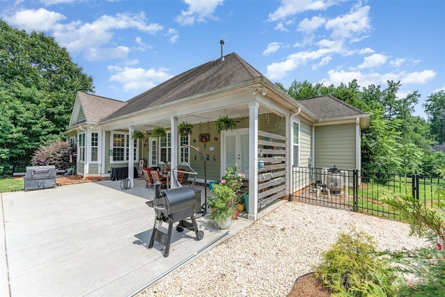 6603 Havencrest Dr, Denver, NC 28037 - rear view of house featuring a patio, a shingled roof, and french doors