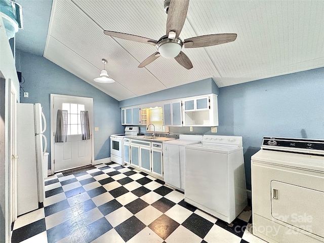 kitchen with washer and dryer, a ceiling fan, a sink, tile patterned floors, and white appliances