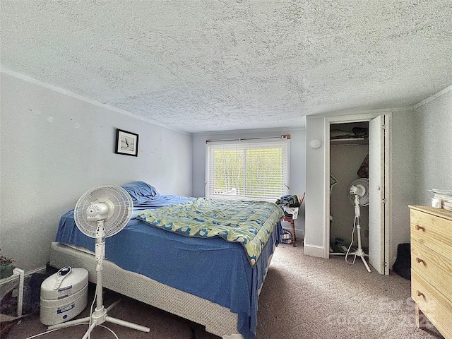 carpeted bedroom with a closet and a textured ceiling