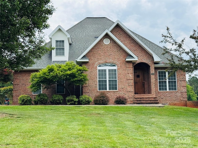 5518 Land Harbour Dr, Granite Falls, NC 28630 - view of front of house with brick siding, roof with shingles, and a front lawn
