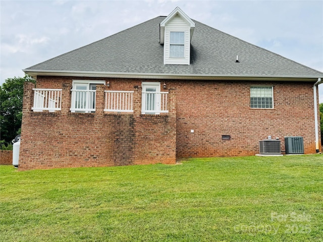 5518 Land Harbour Dr, Granite Falls, NC 28630 - rear view of house featuring central air condition unit, a lawn, brick siding, and roof with shingles