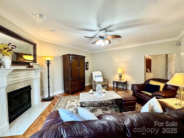 5518 Land Harbour Dr, Granite Falls, NC 28630 - living room featuring crown molding, ceiling fan, a fireplace, baseboards, and wood finished floors
