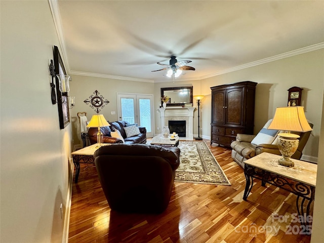 5518 Land Harbour Dr, Granite Falls, NC 28630 - living area with crown molding, a ceiling fan, wood finished floors, and a fireplace