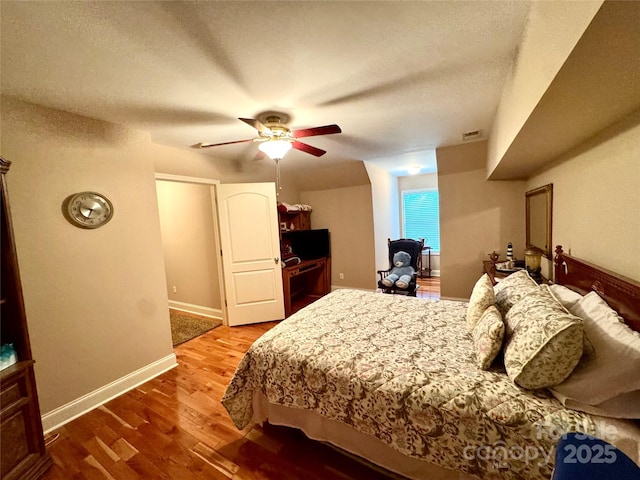 5518 Land Harbour Dr, Granite Falls, NC 28630 - bedroom featuring visible vents, wood finished floors, baseboards, a textured ceiling, and a ceiling fan