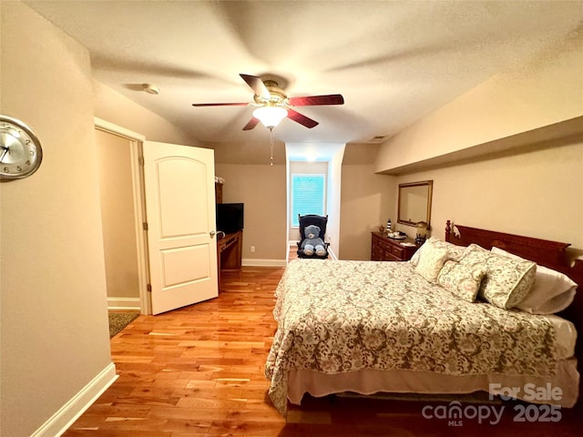 5518 Land Harbour Dr, Granite Falls, NC 28630 - bedroom with baseboards, ceiling fan, and light wood-style floors