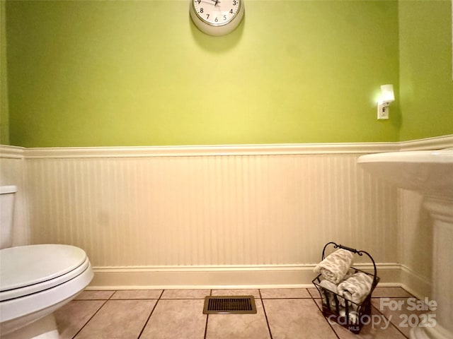 5518 Land Harbour Dr, Granite Falls, NC 28630 - bathroom featuring toilet, tile patterned floors, visible vents, and wainscoting