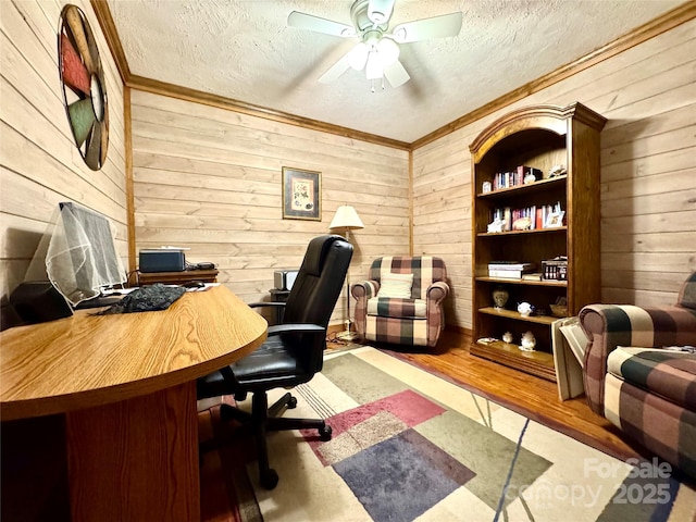 5518 Land Harbour Dr, Granite Falls, NC 28630 - home office with crown molding, a ceiling fan, a textured ceiling, and wooden walls