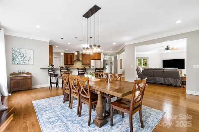 dining room featuring ceiling fan, light wood finished floors, and recessed lighting