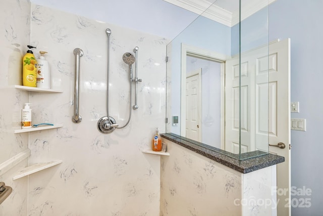 full bathroom with a marble finish shower and ornamental molding