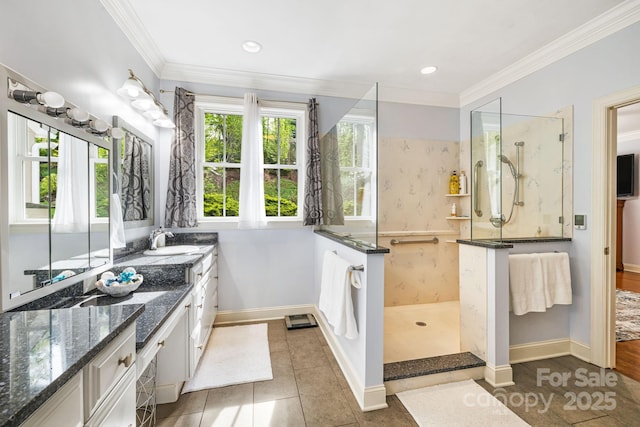 bathroom with walk in shower, a wealth of natural light, and baseboards