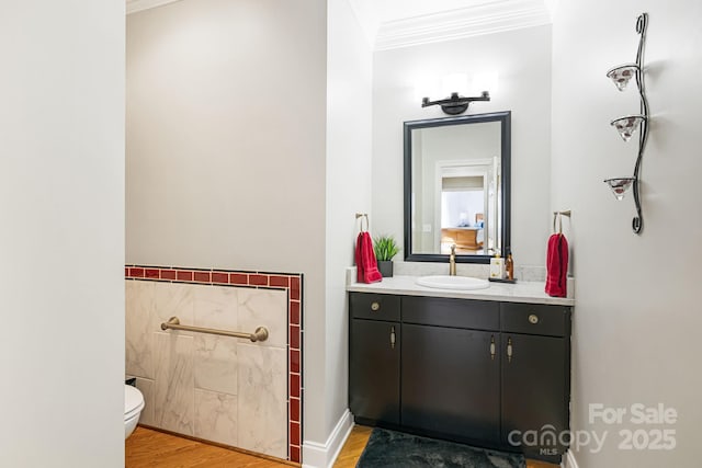 half bathroom featuring toilet, ornamental molding, tile walls, and wood finished floors