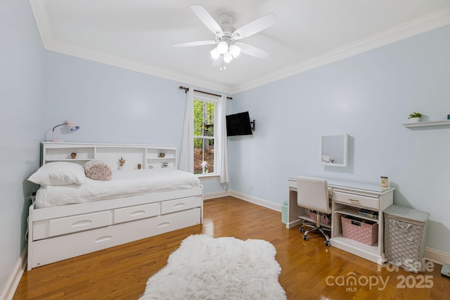 bedroom with baseboards, ornamental molding, ceiling fan, and wood finished floors