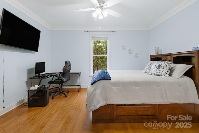 bedroom featuring baseboards, ornamental molding, ceiling fan, and wood finished floors
