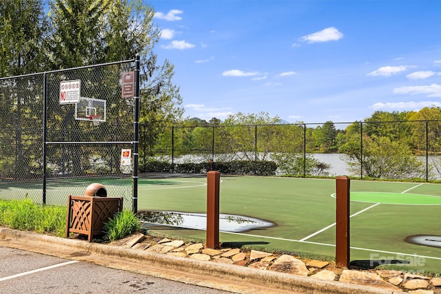 view of basketball court with fence and community basketball court