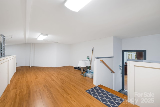 finished below grade area with light wood-type flooring
