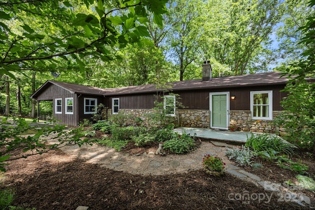1128 Forest St, Mars Hill, NC 28754 - view of front of home with stone siding and a chimney