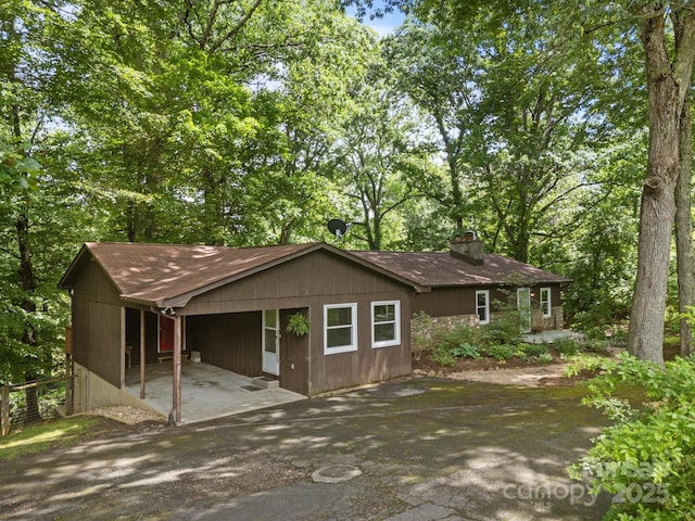 1128 Forest St, Mars Hill, NC 28754 - view of front of house featuring a chimney and asphalt driveway