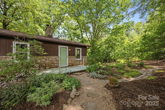 1128 Forest St, Mars Hill, NC 28754 - back of property with stone siding and a chimney