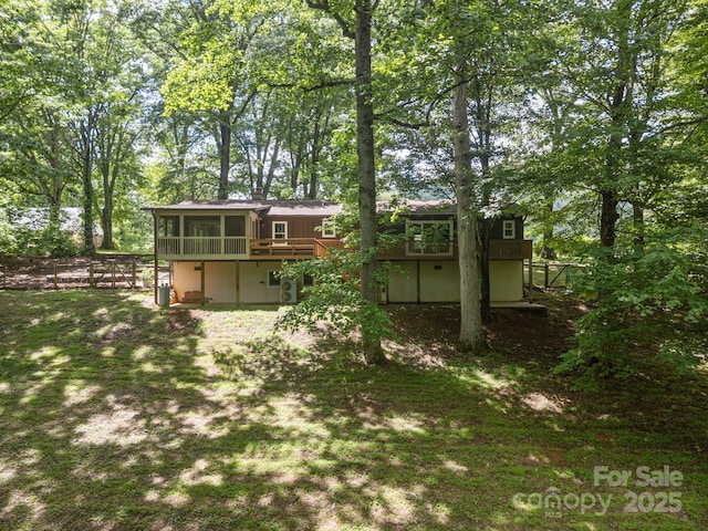 1128 Forest St, Mars Hill, NC 28754 - back of property with a sunroom, a wooden deck, and view of scattered trees