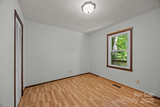 1128 Forest St, Mars Hill, NC 28754 - unfurnished bedroom featuring light wood-style floors, a closet, and baseboards
