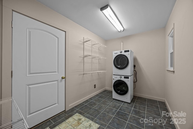 1128 Forest St, Mars Hill, NC 28754 - laundry area featuring stacked washing machine and dryer and baseboards