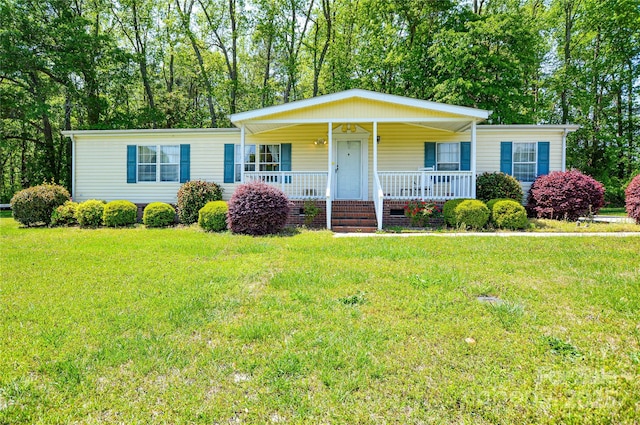 view of front of house with covered porch, a front lawn, and crawl space