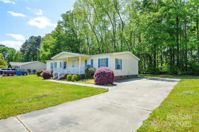 view of front of home featuring a porch, concrete driveway, a front lawn, and crawl space