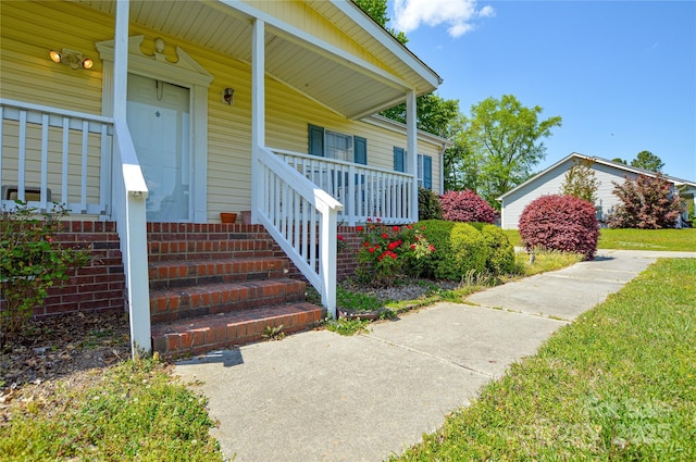 doorway to property with covered porch